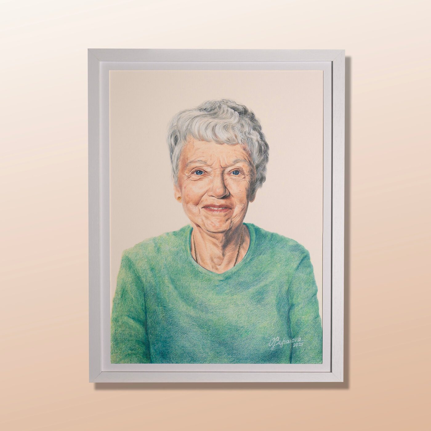 Framed coloured pencil portrait of Margaret, an older woman in a green jumper